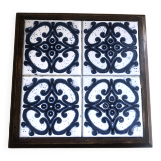 Large wood and earthenware trivet with vintage relief decoration