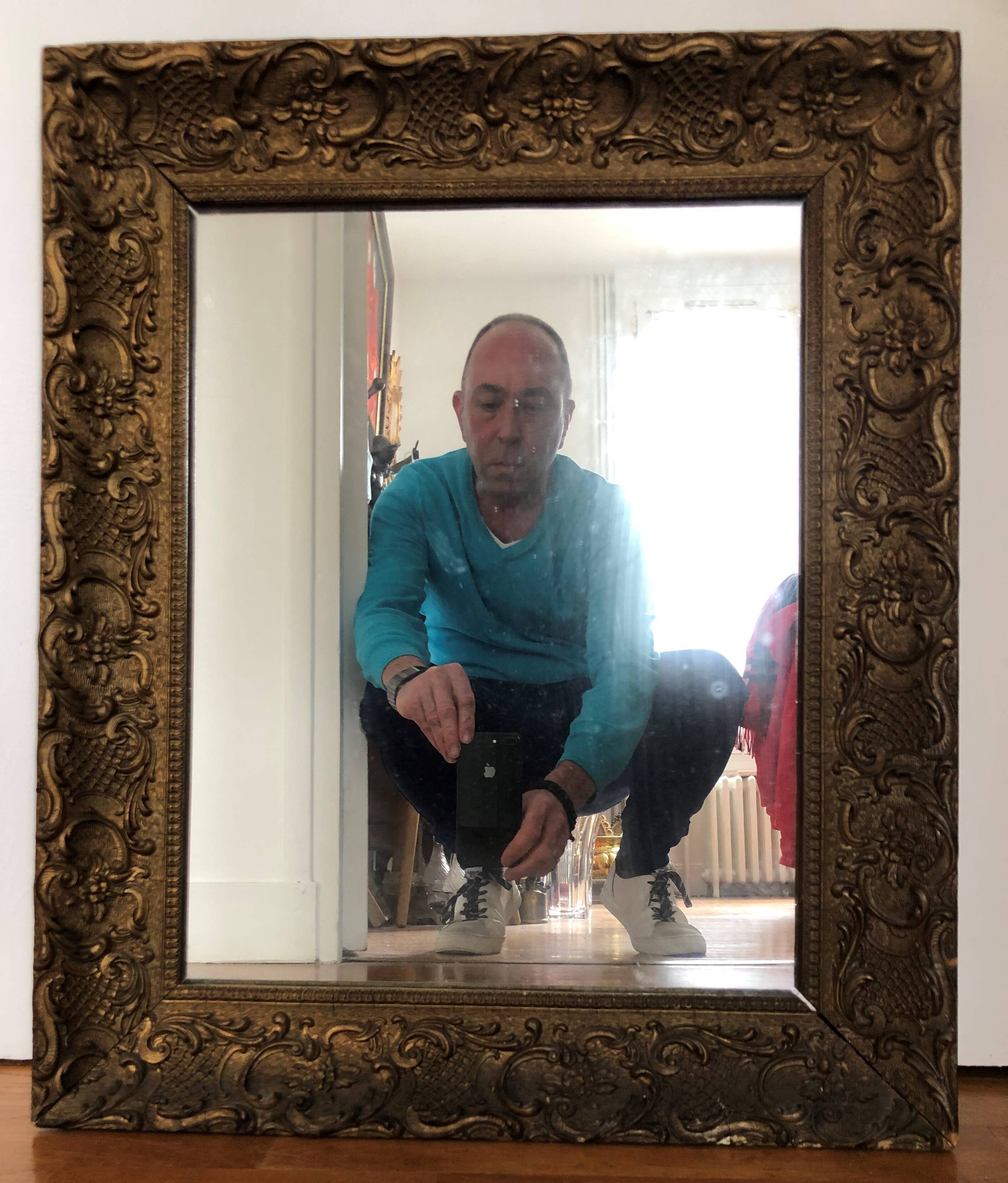 Carved and gilded wooden mirror