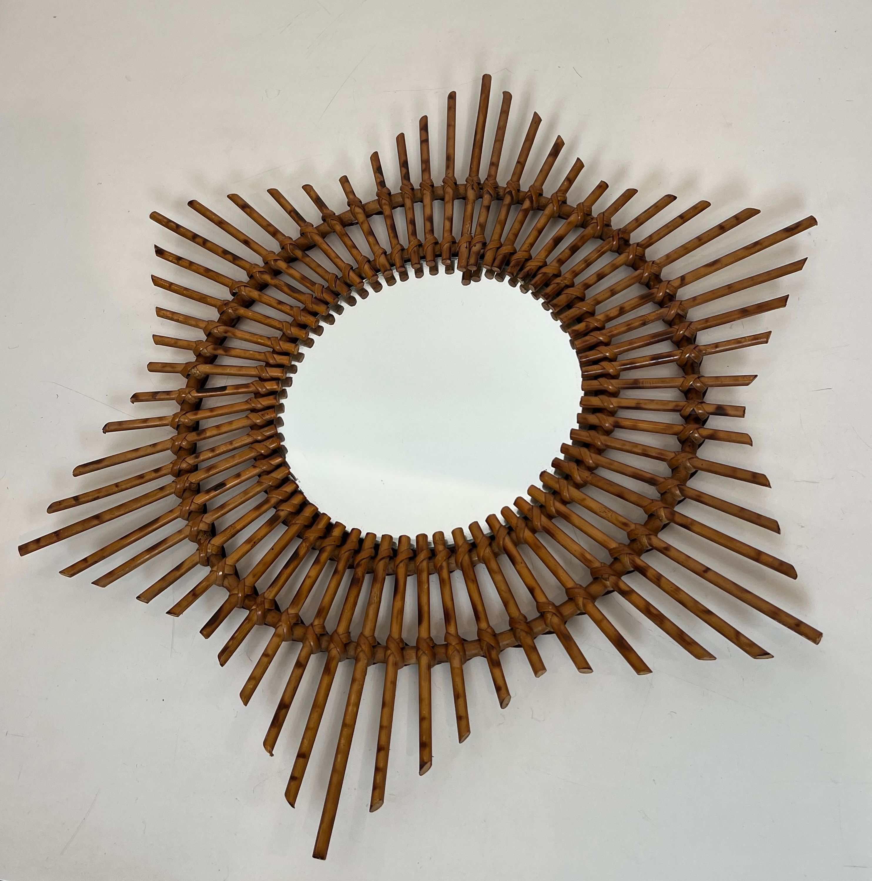 Rattan mirror in the shape of a star.