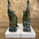 Pair of art deco bookends with elephant decoration in regulated and travertine, vintage