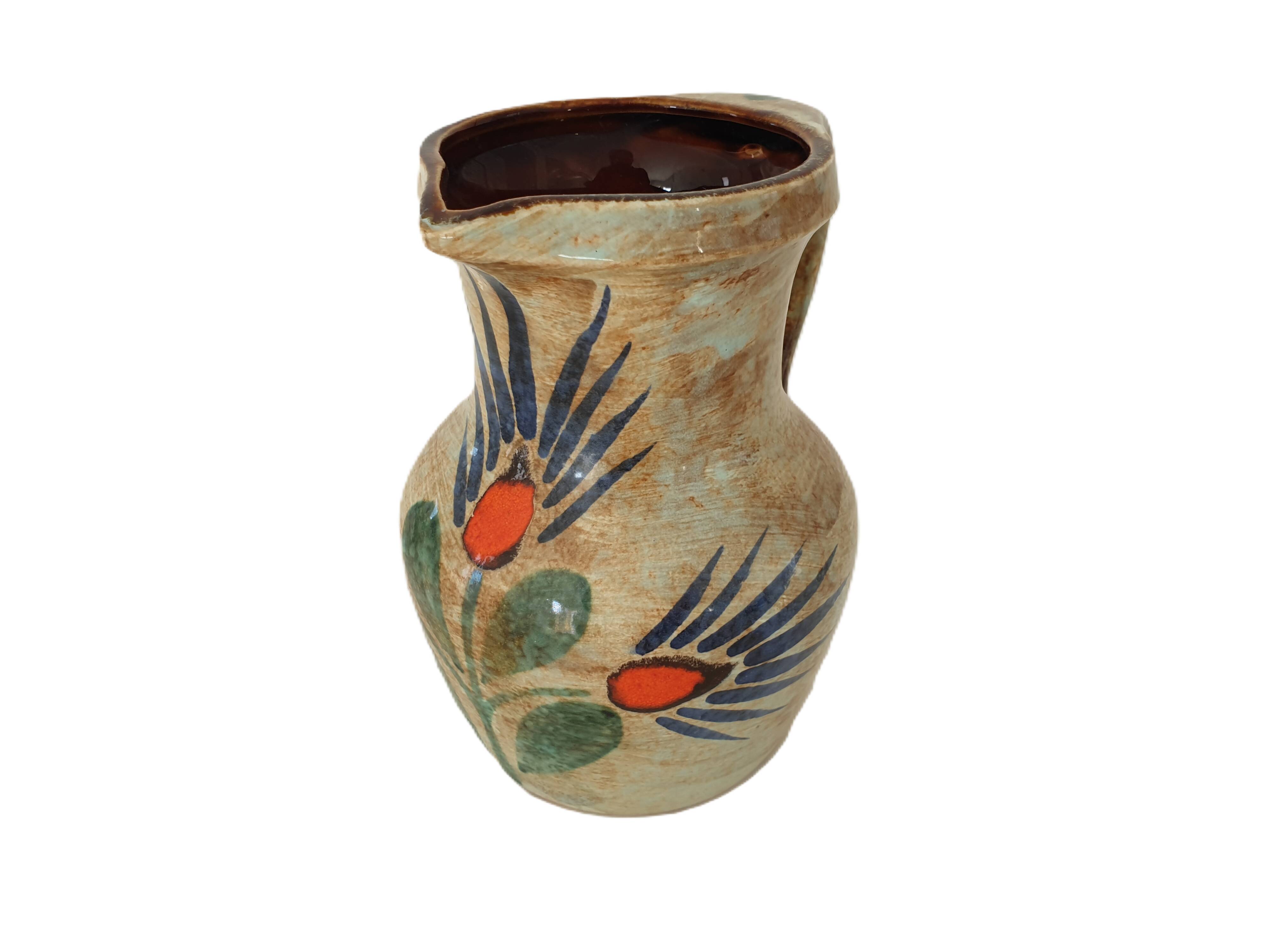 Ceramic pitcher with floral motif signed Saint Clément