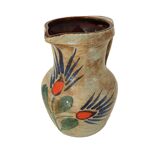 Ceramic pitcher with floral motif signed Saint Clément
