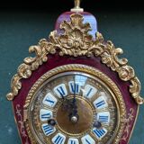 Boudoir clock on Louis XIV style console.