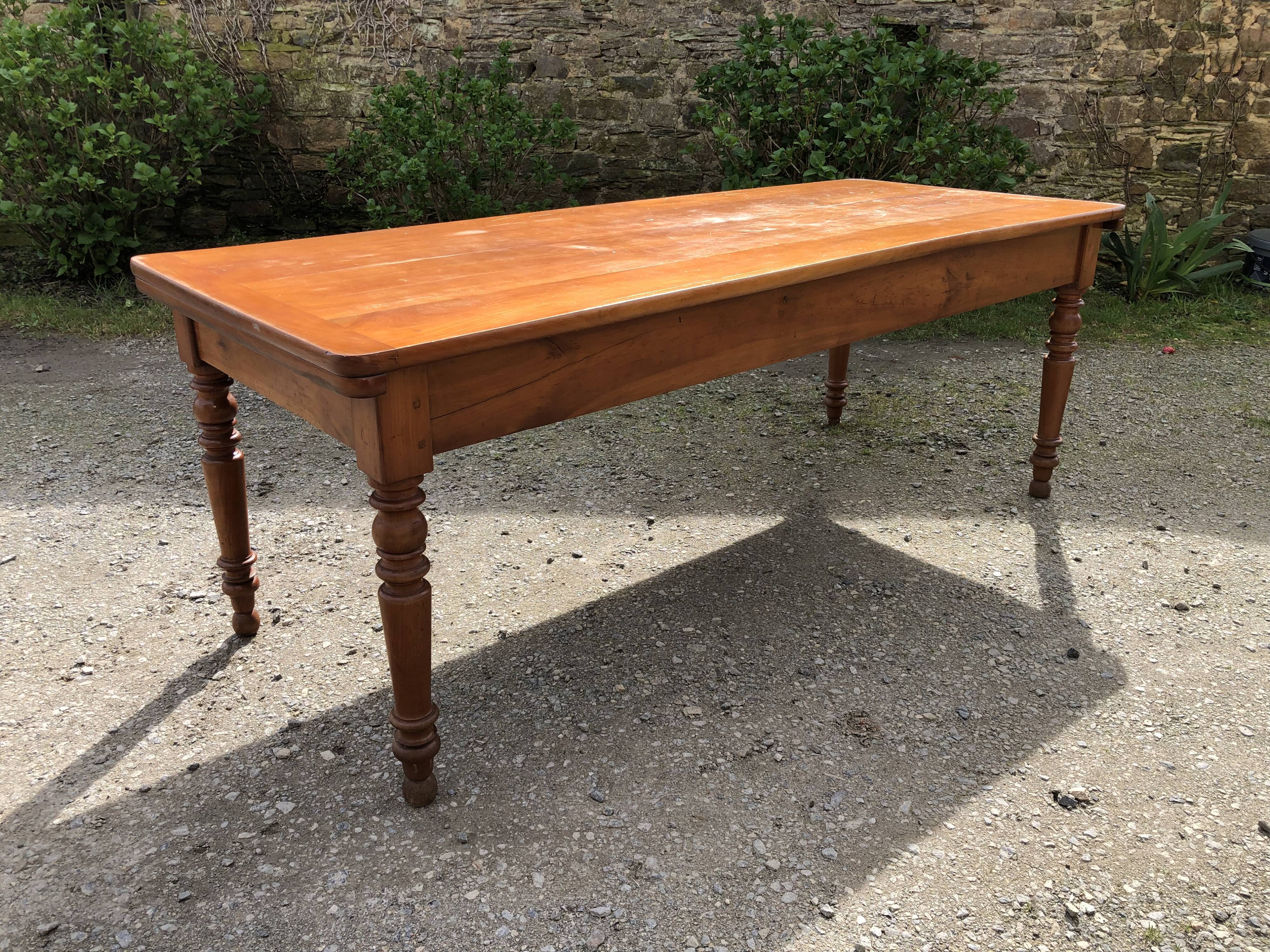 Antique Louis Philippe style farmhouse table in solid cherry wood with its 2 extensions.
