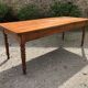 Antique Louis Philippe style farmhouse table in solid cherry wood with its 2 extensions.