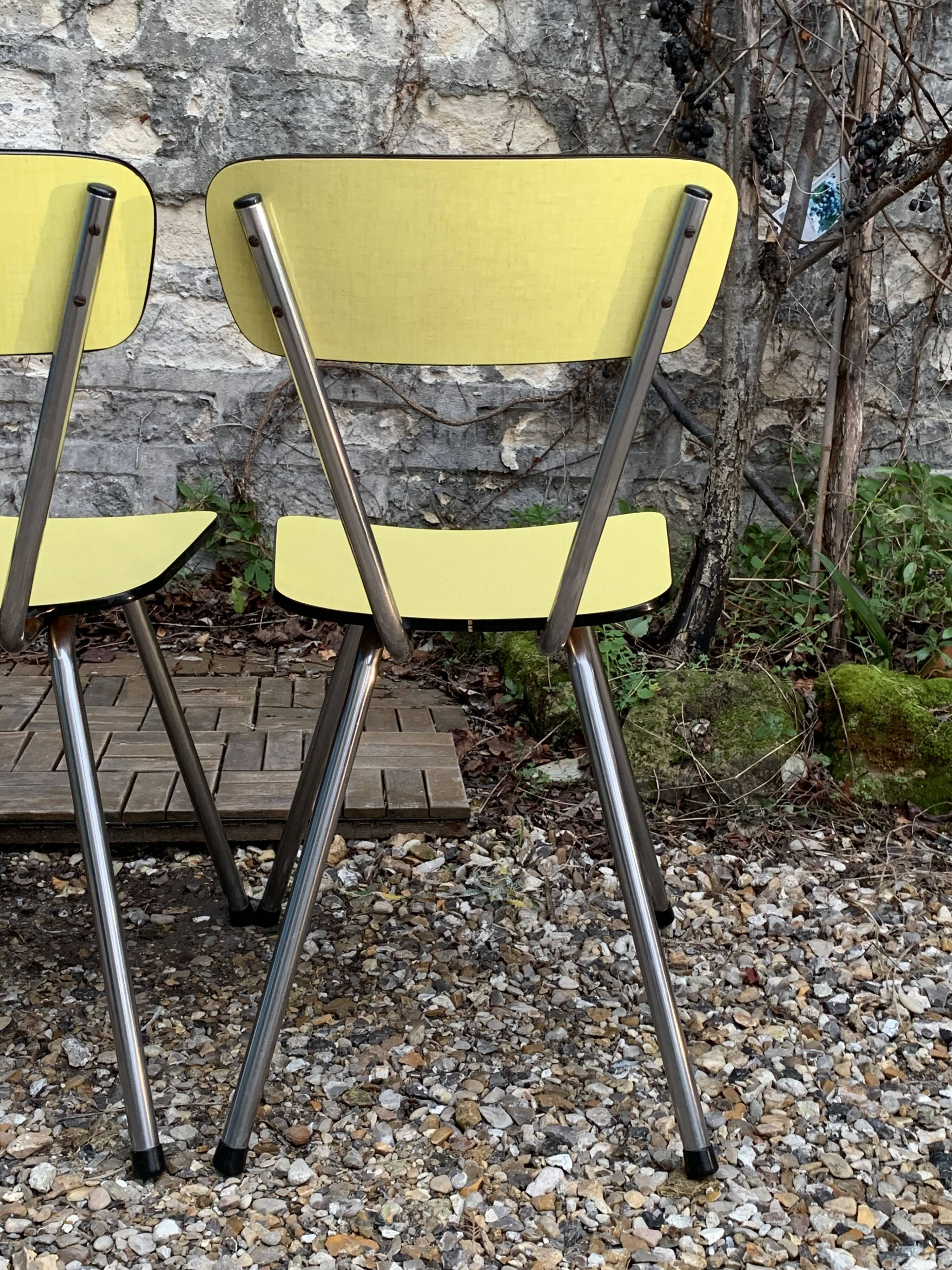 Yellow Formica chairs with compass legs, 1950s