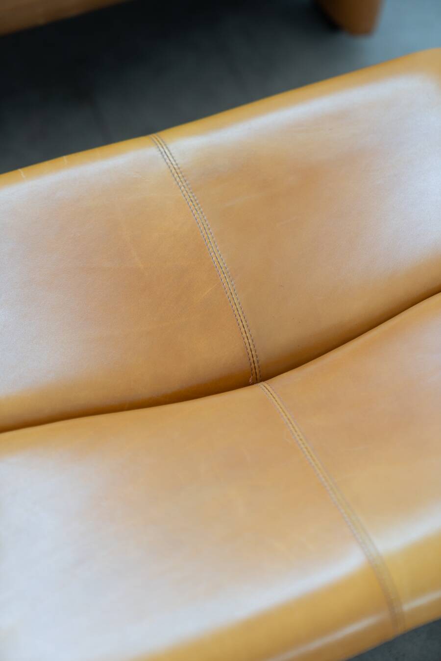 Pair of armchairs with cognac-colored pouf, "Coronado" model by Afra & Tobia scarpa for B&B It