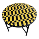 Round coffee table in yellow and black zellige, Moroccan graphic pattern.