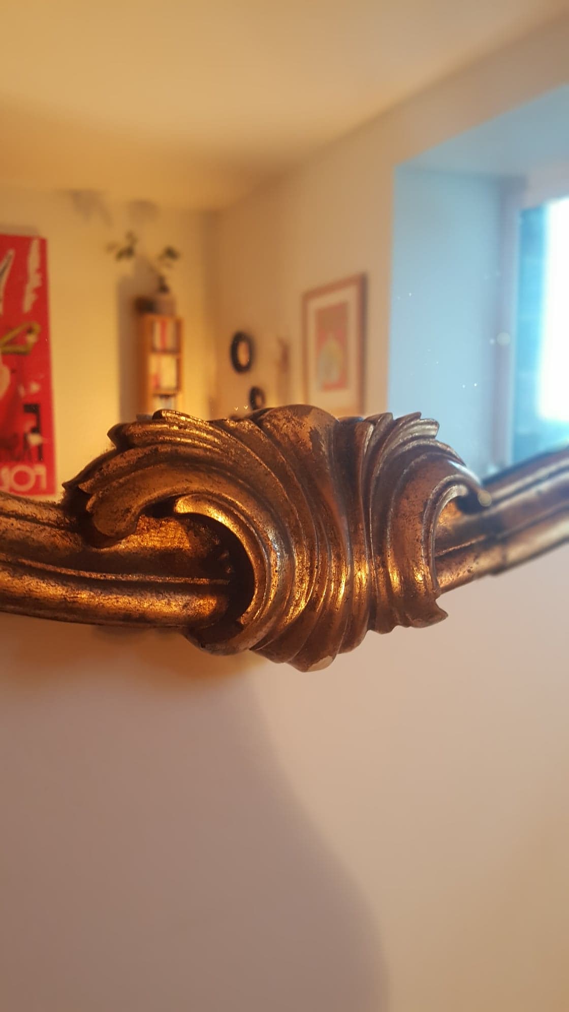 Mirror with golden mouldings