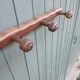 Small antique wooden wall coat rack.
