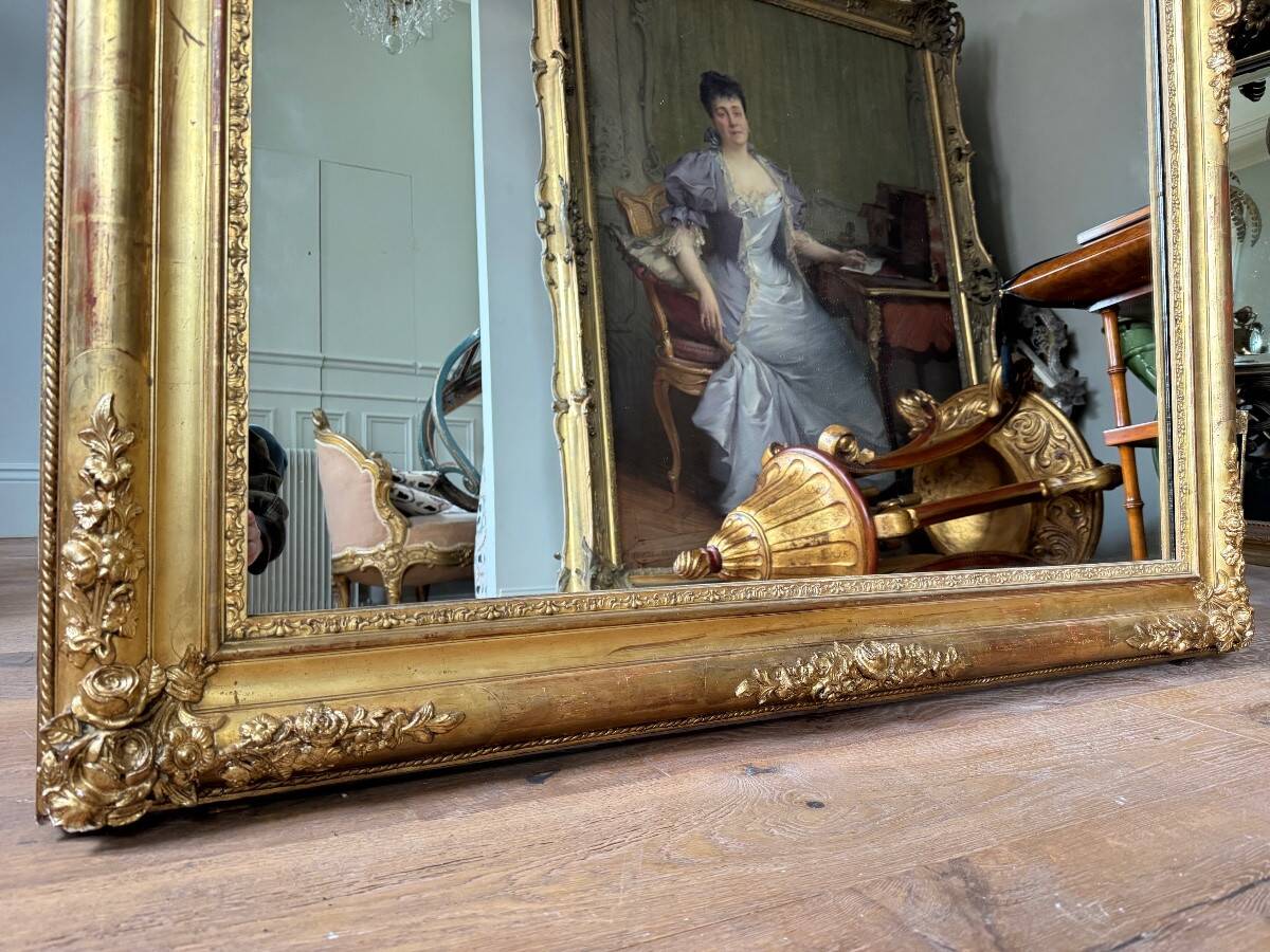 Restoration period mirror in gilded wood from the Napoleonic III era, 165 cm x 130 cm.