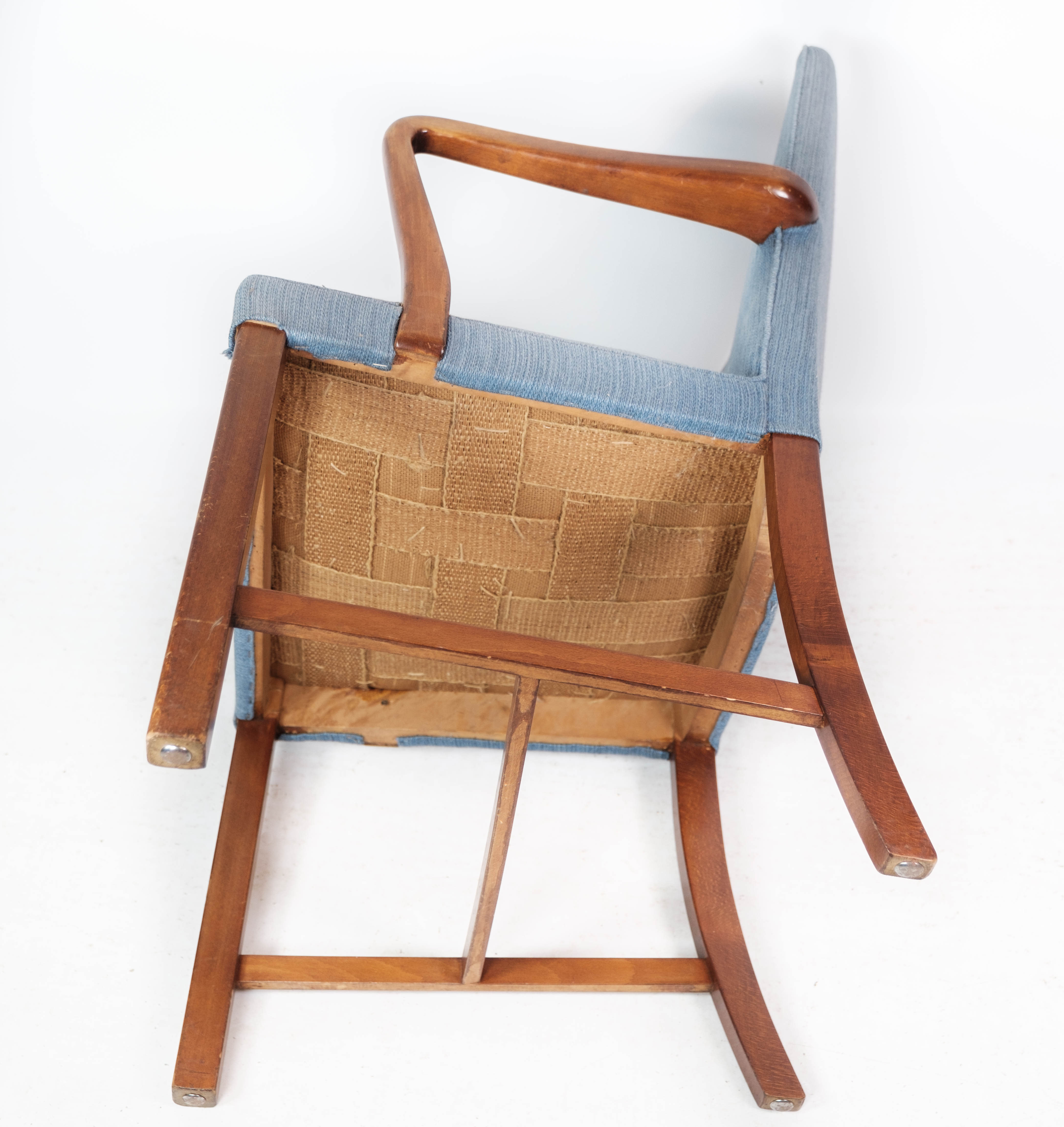 Armchair in mahogany and upholstered with light blue fabric by Fritz Hansen