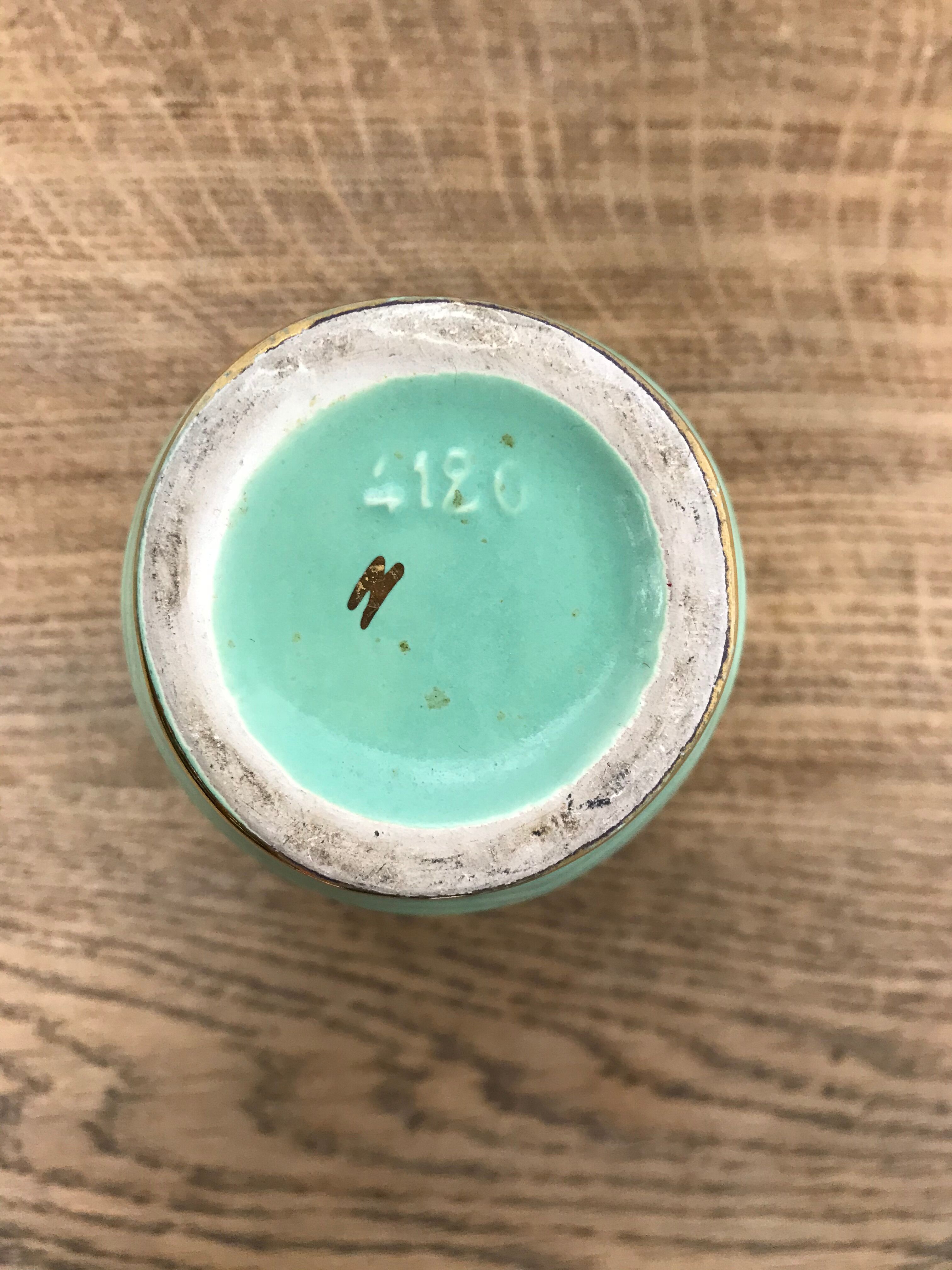 Green and gold ceramic vase