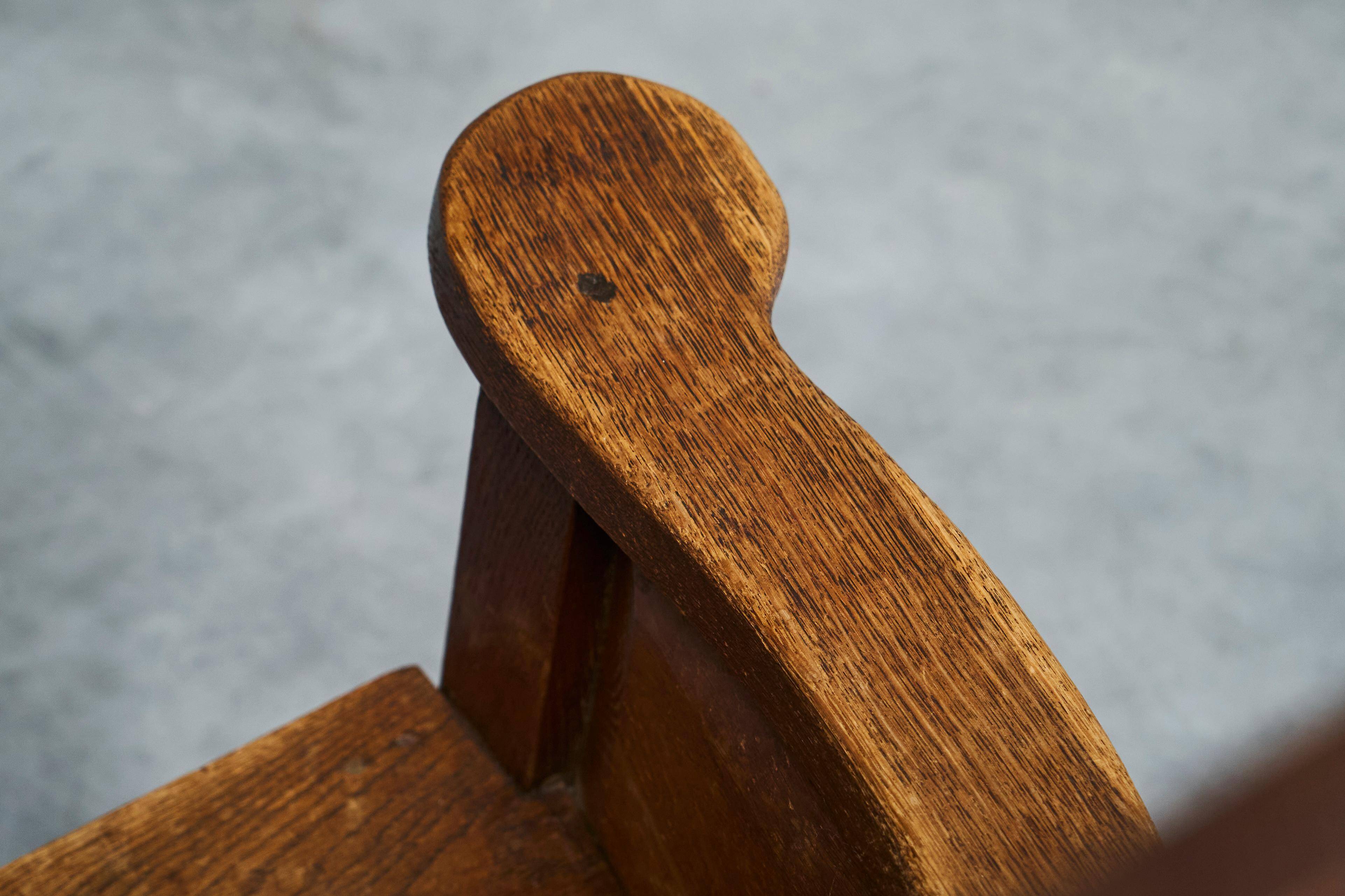 Antique solid oak armchair, 19th-century farmer style.