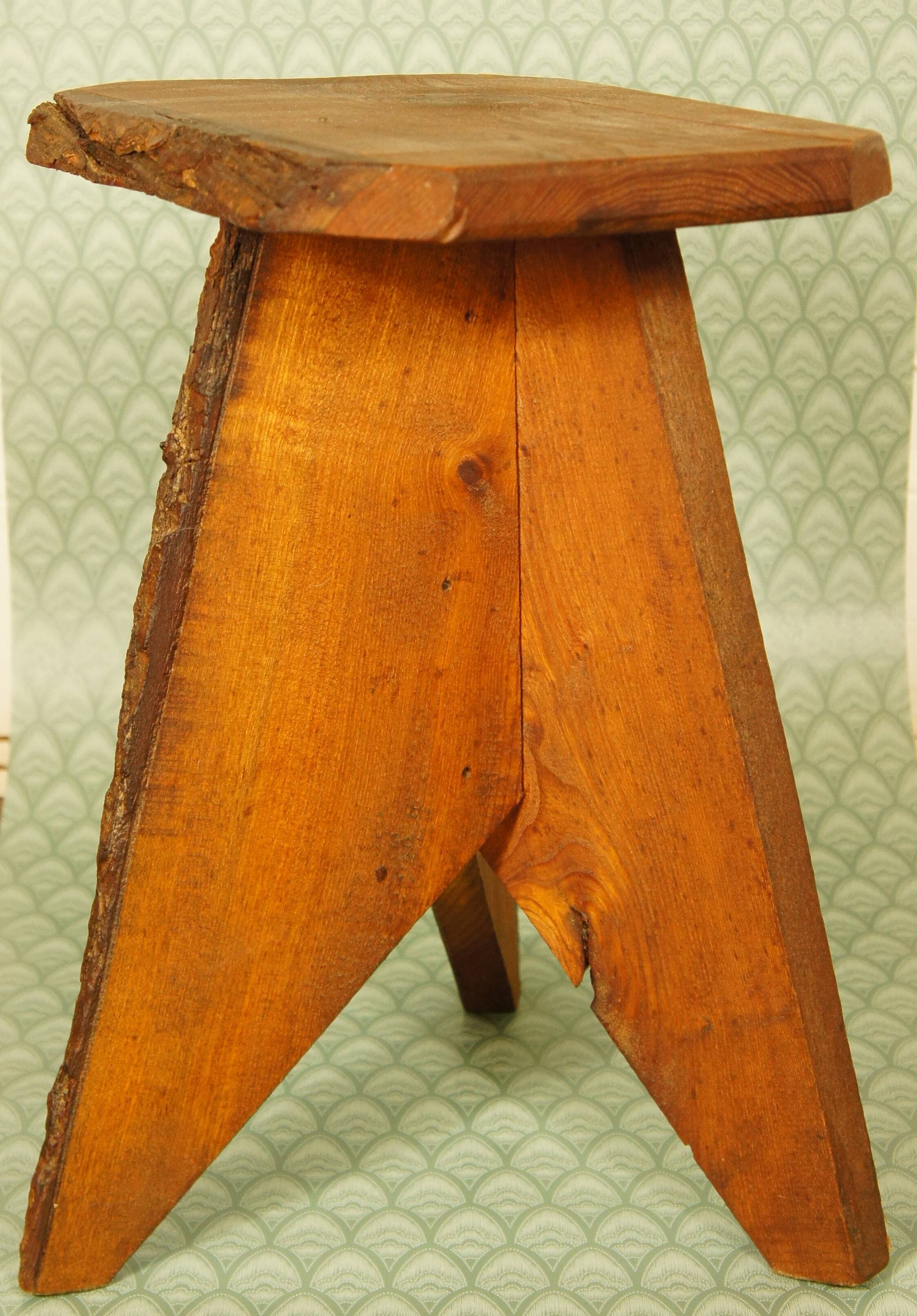 Brutalist stool tripod feet cross