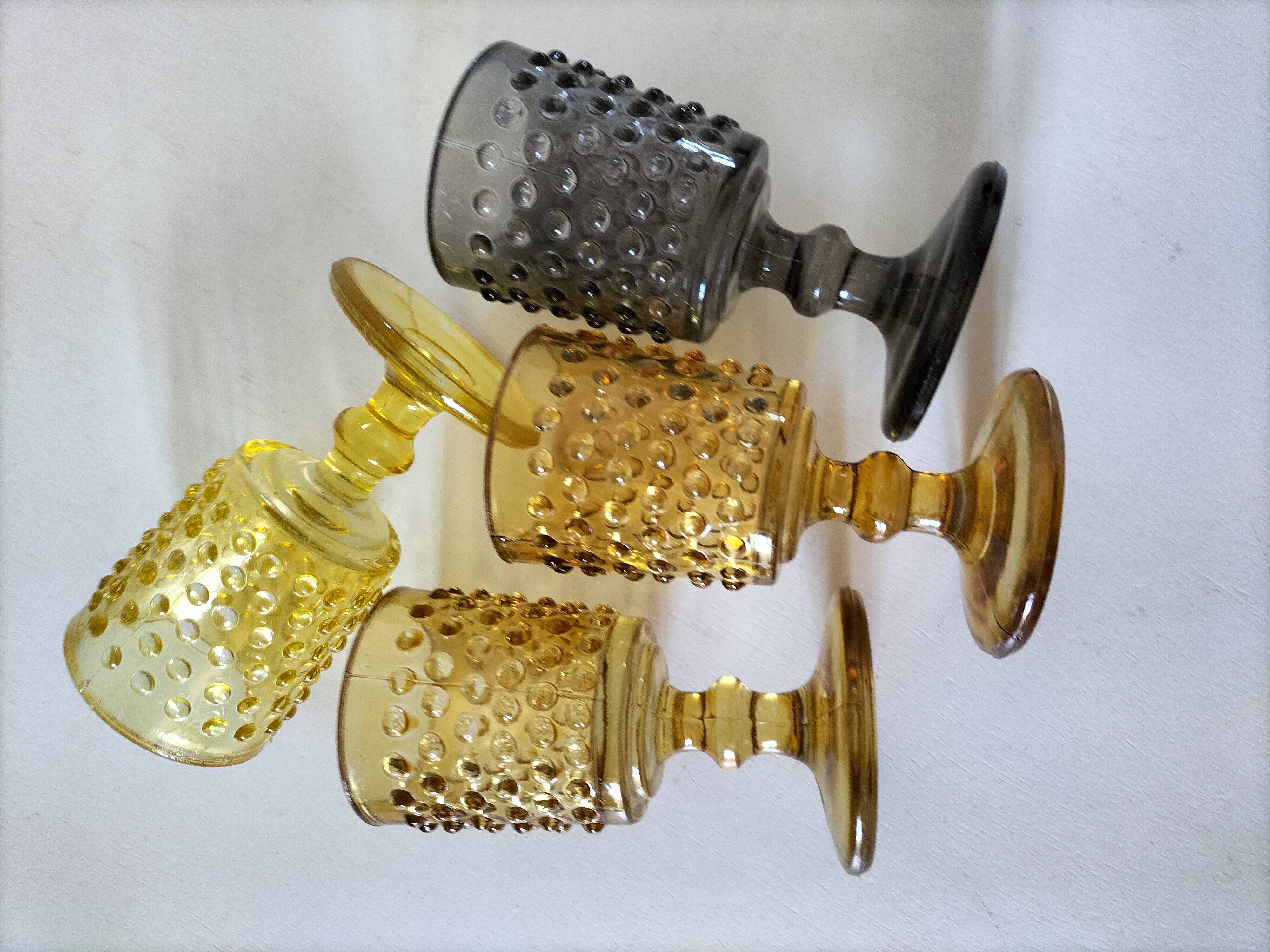 4 vintage stemmed glasses in hobnail glass and smoke colour.