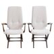 Pair of varnished wooden reclining armchairs, upholstered in lightweight fabric.
