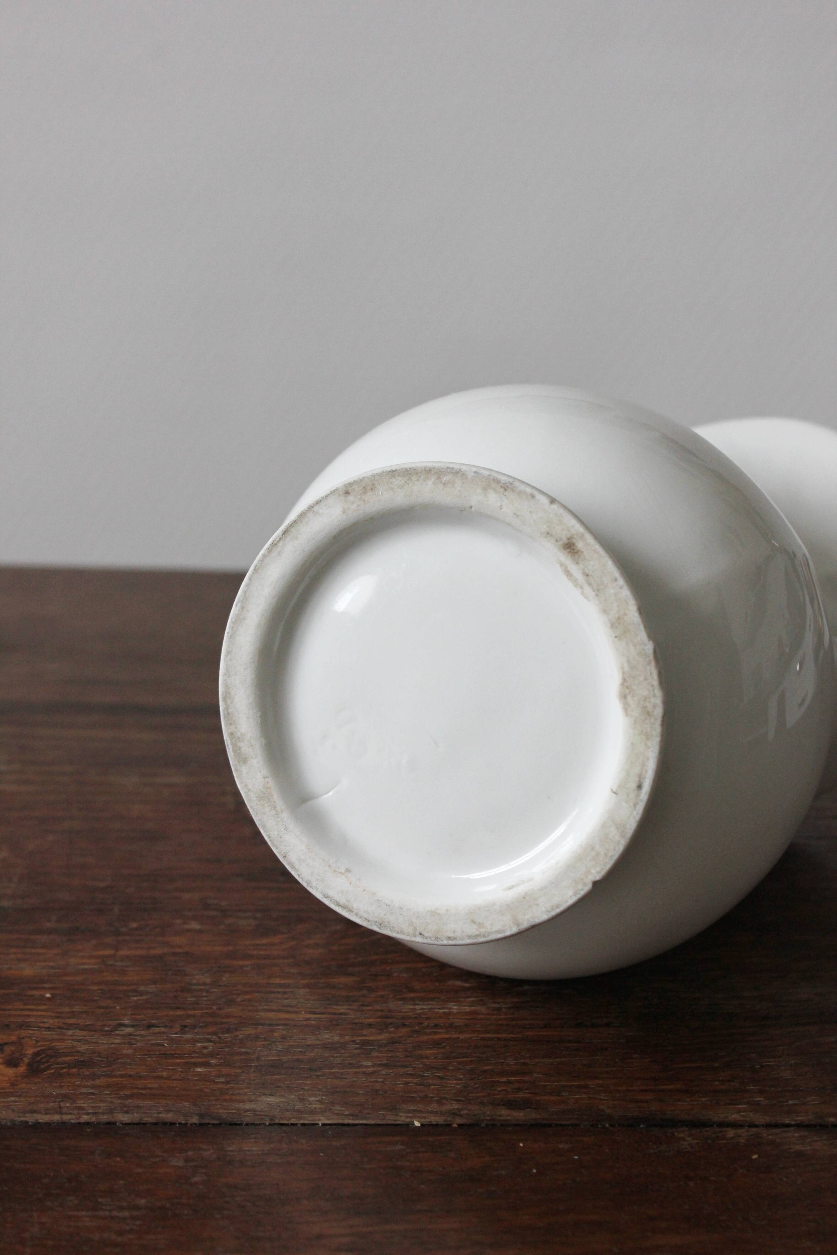 Old broc in white earthenware