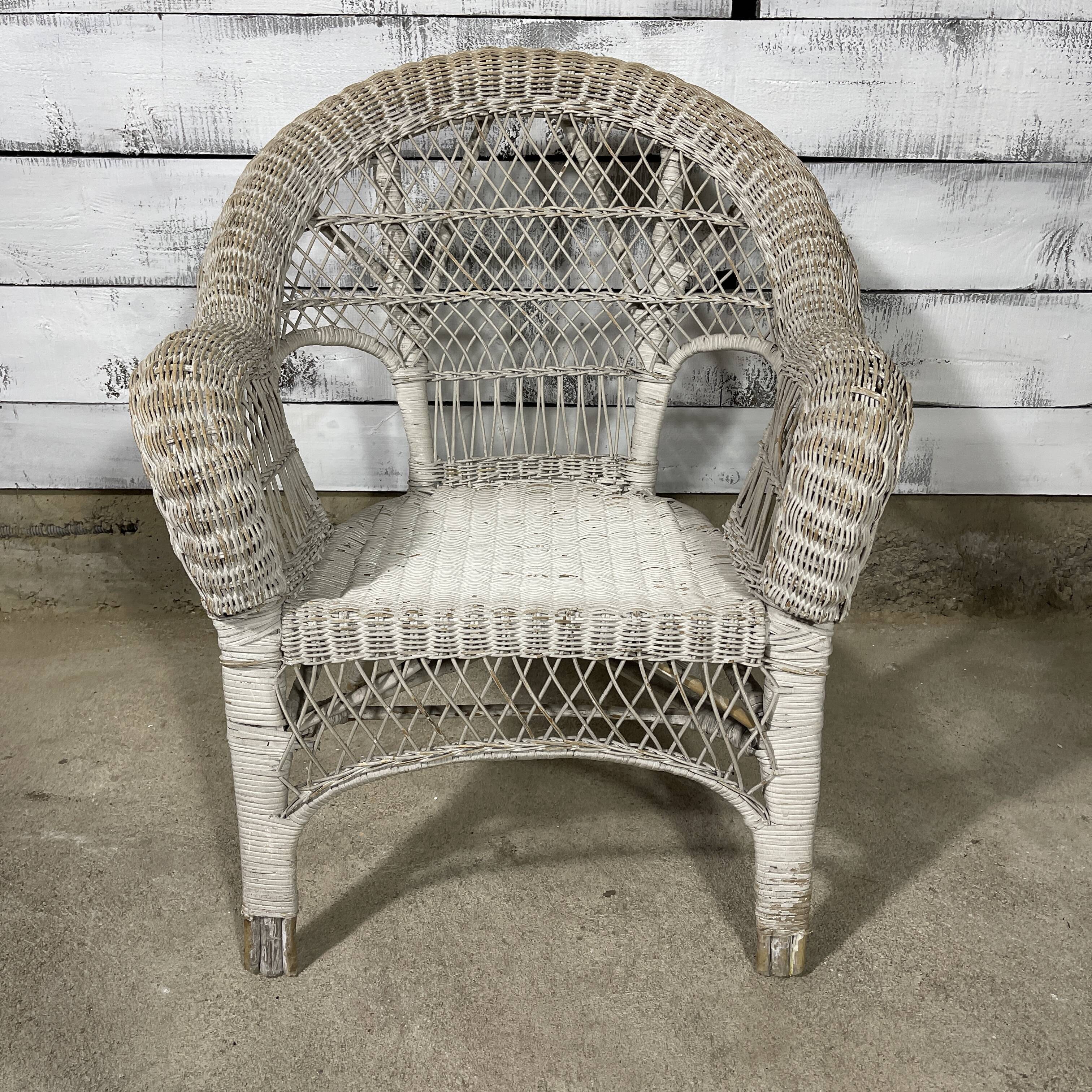 Vintage white rattan armchair