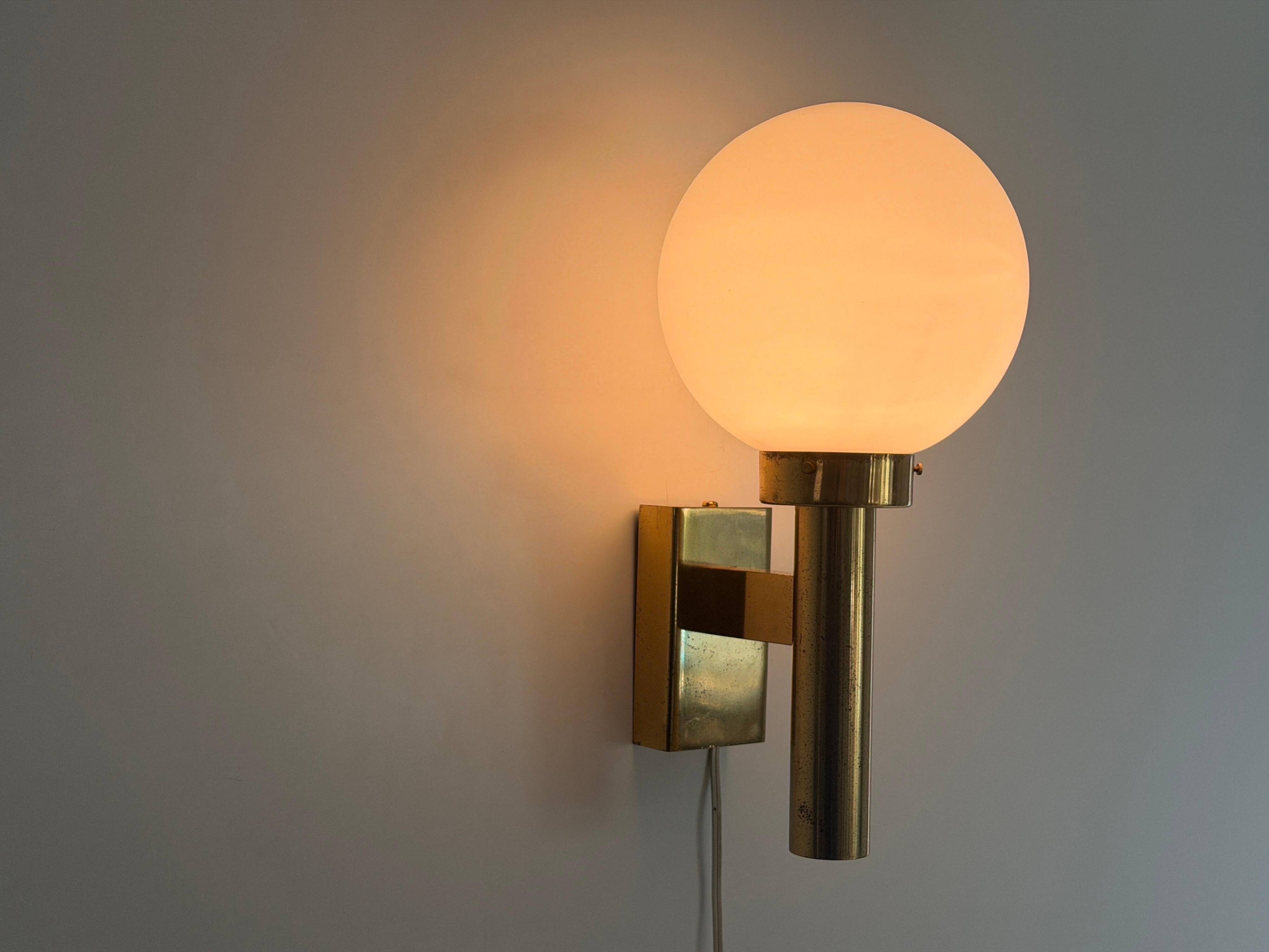 Large minimalist cinema wall light in opal glass and heavy brass, 1960s, Germany