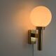 Large minimalist cinema wall light in opal glass and heavy brass, 1960s, Germany