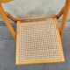 Wooden folding chair with caning from the 1980s.