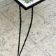 Vintage coffee table in wrought iron with floral tiles.