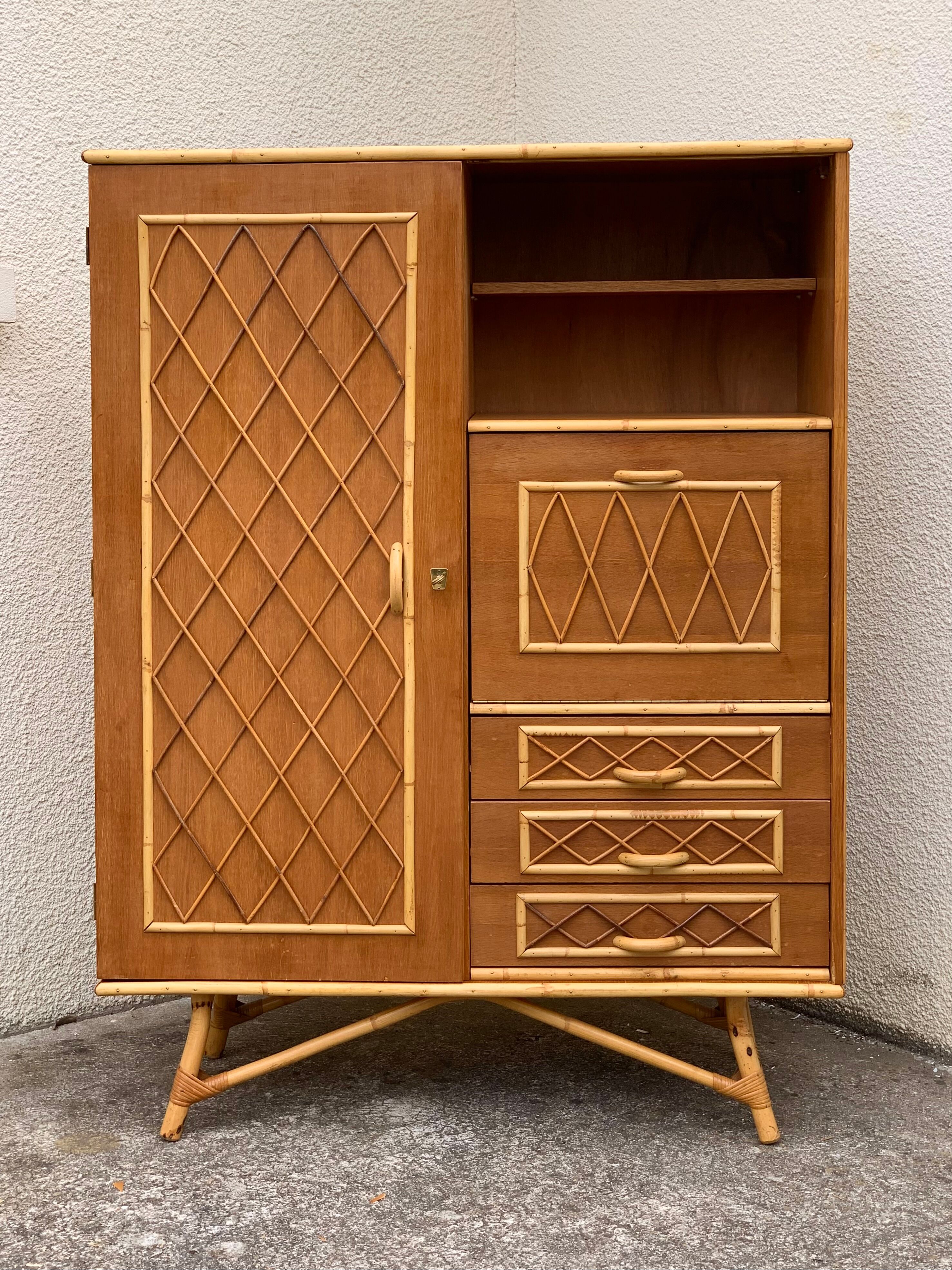 Rattan wardrobe with tapered legs from the 1960s.