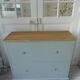 Vintage shoe cabinet green of gray, wooden top.