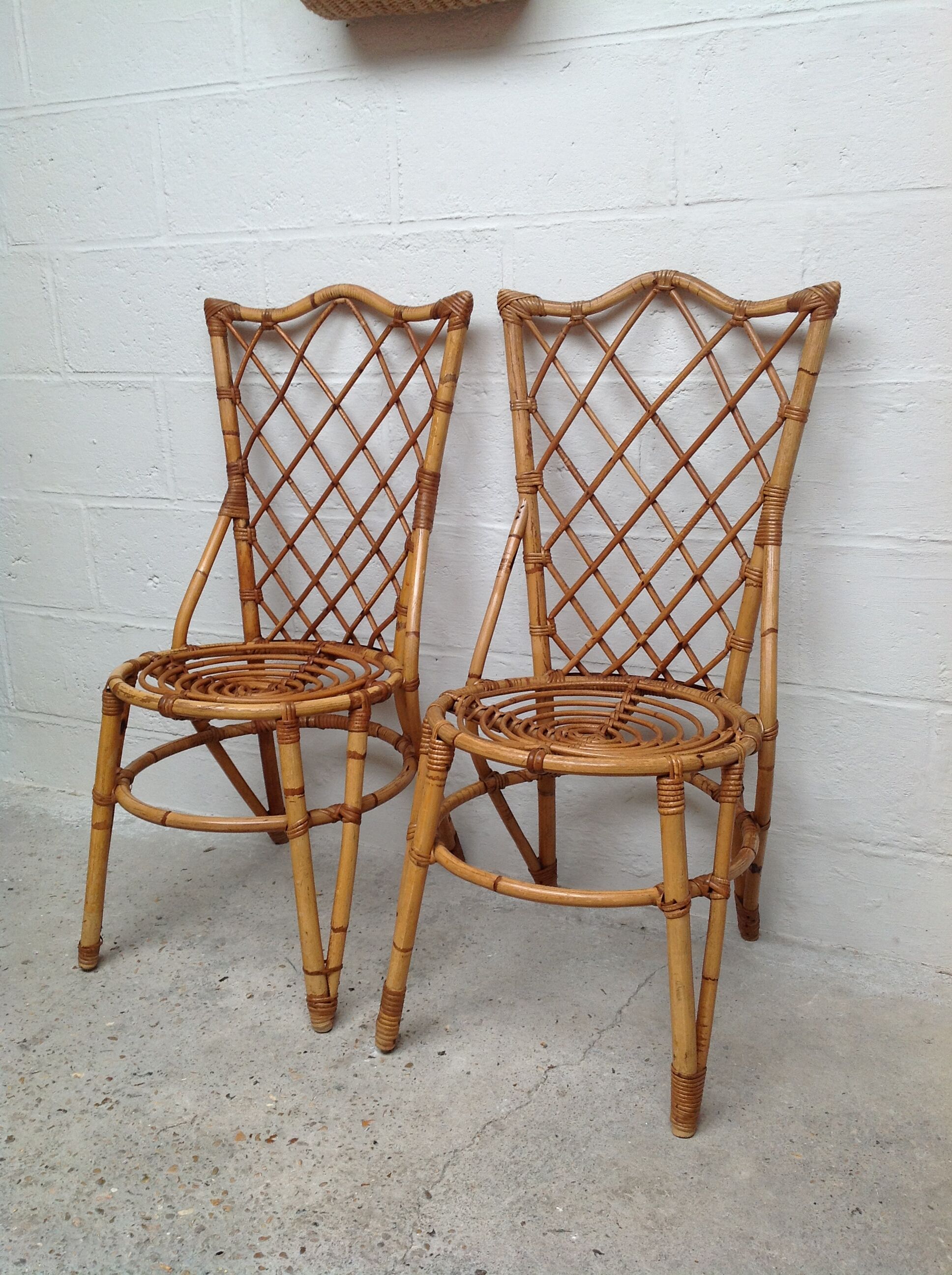 Pair of rattan chairs by Louis Sognot