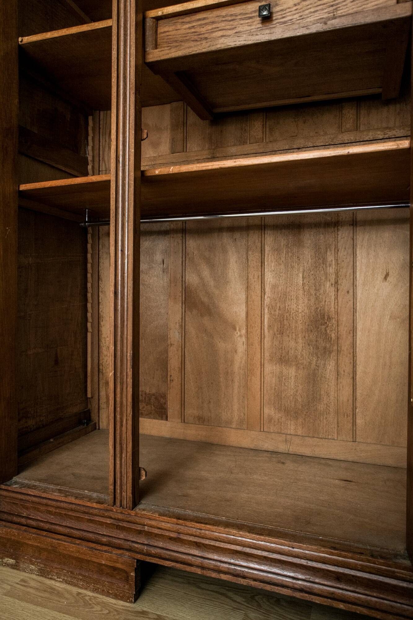 Old solid wood wardrobe with three vintage mirror doors