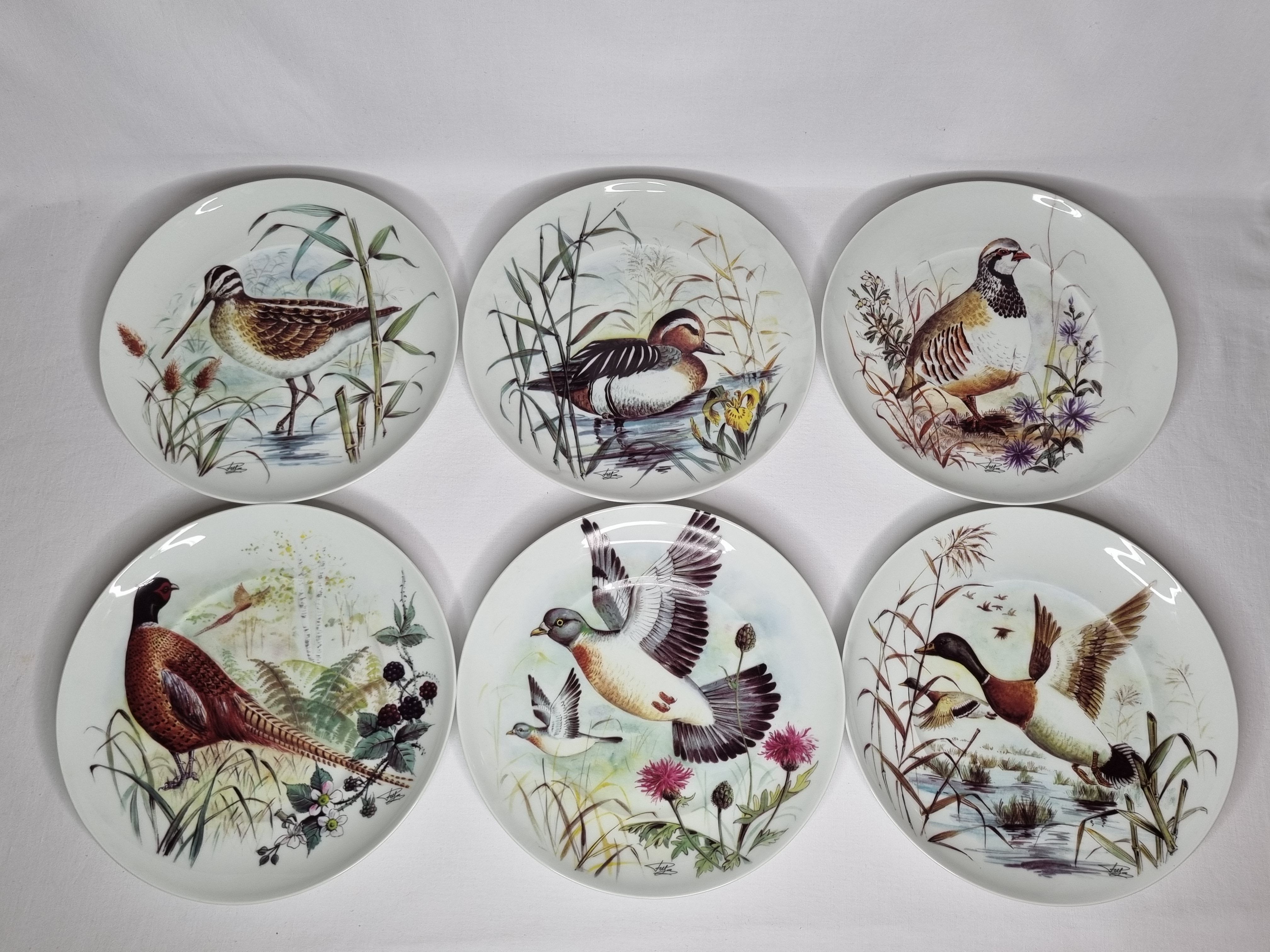 Set of six porcelain plates decorated with birds from Sologne, Limoges, signed, 25 cm