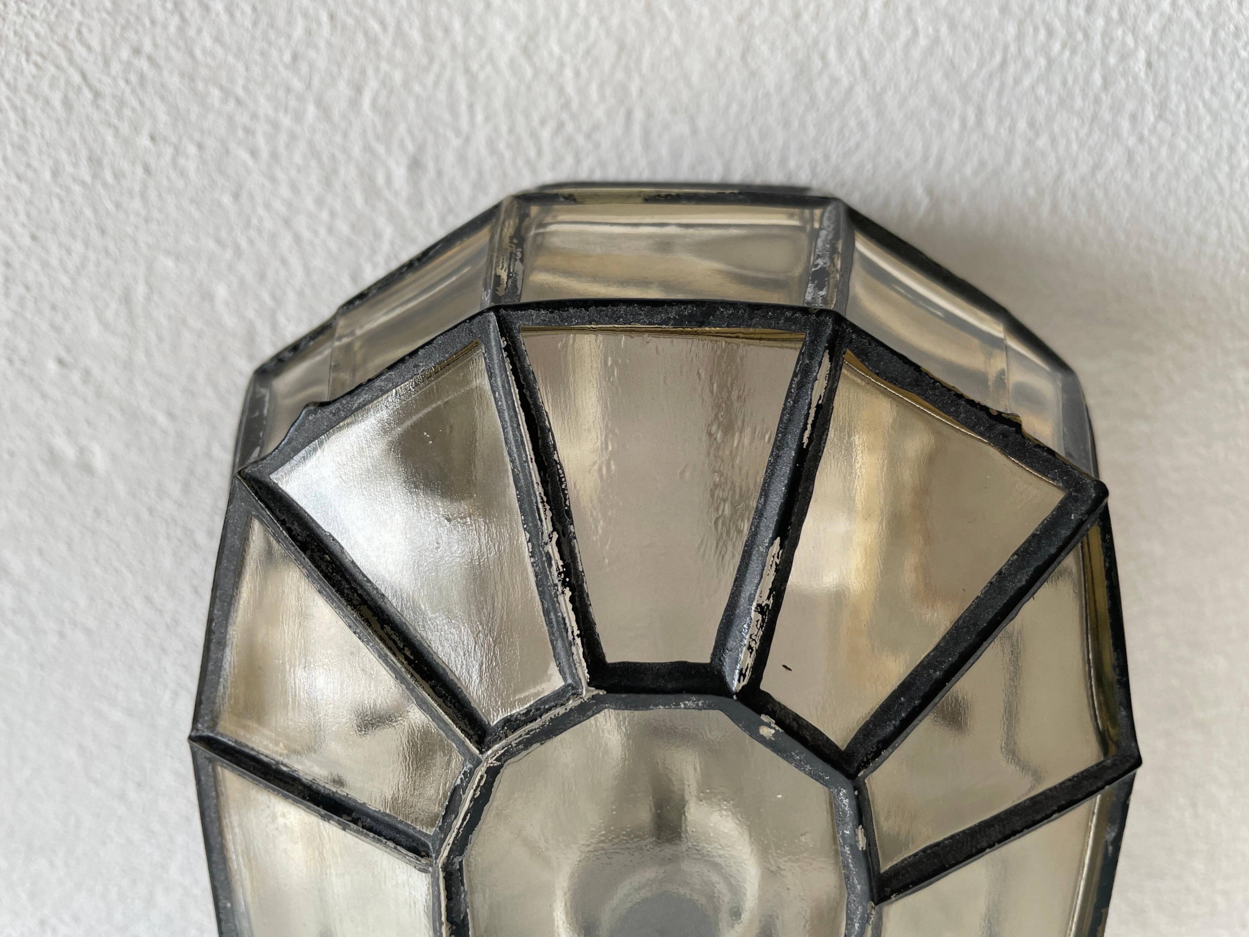 Pair of black iron wall sconces with structured glass by Limburg, 1960s, Germany.