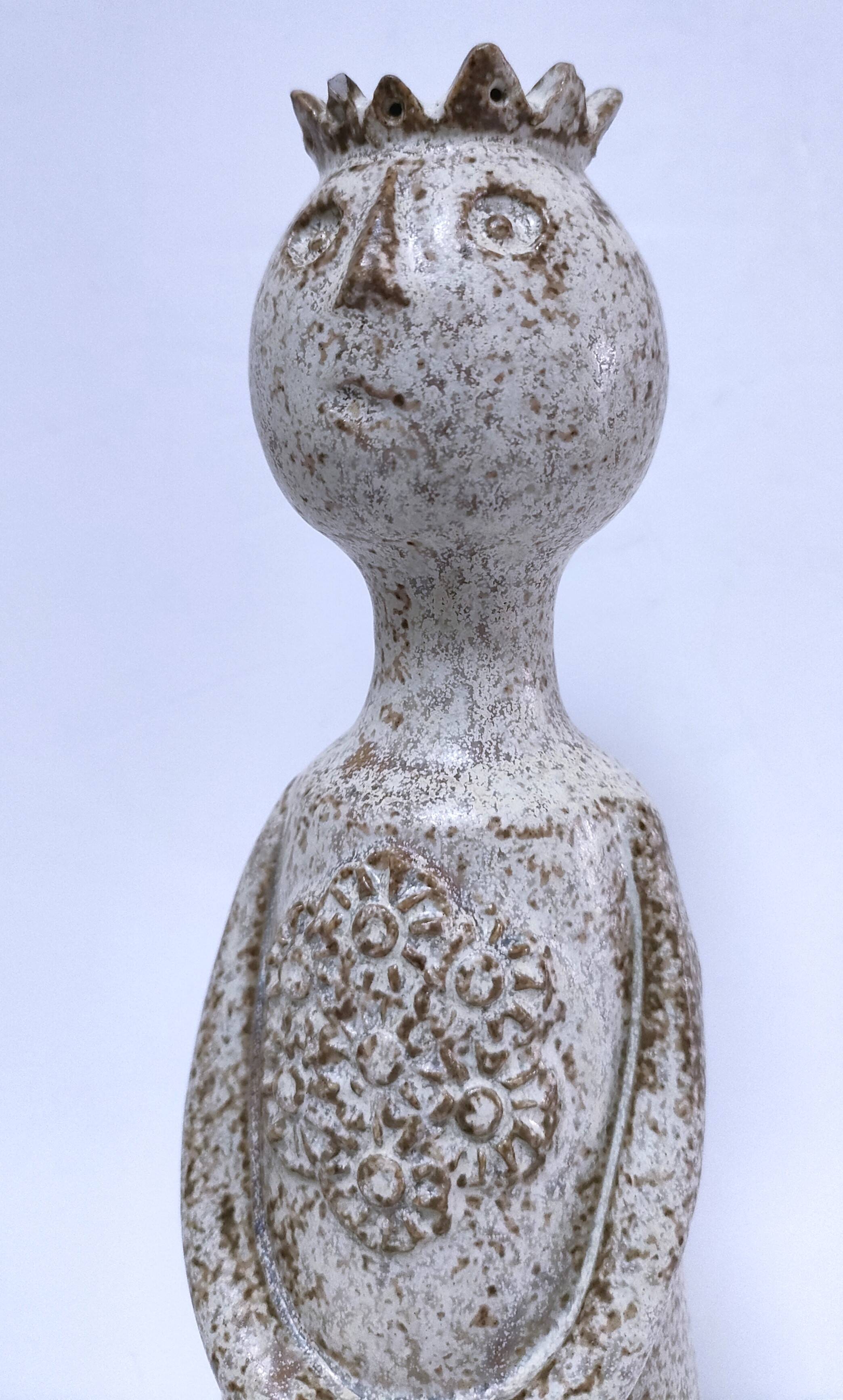 ceramic candle holder with crowned head signed P