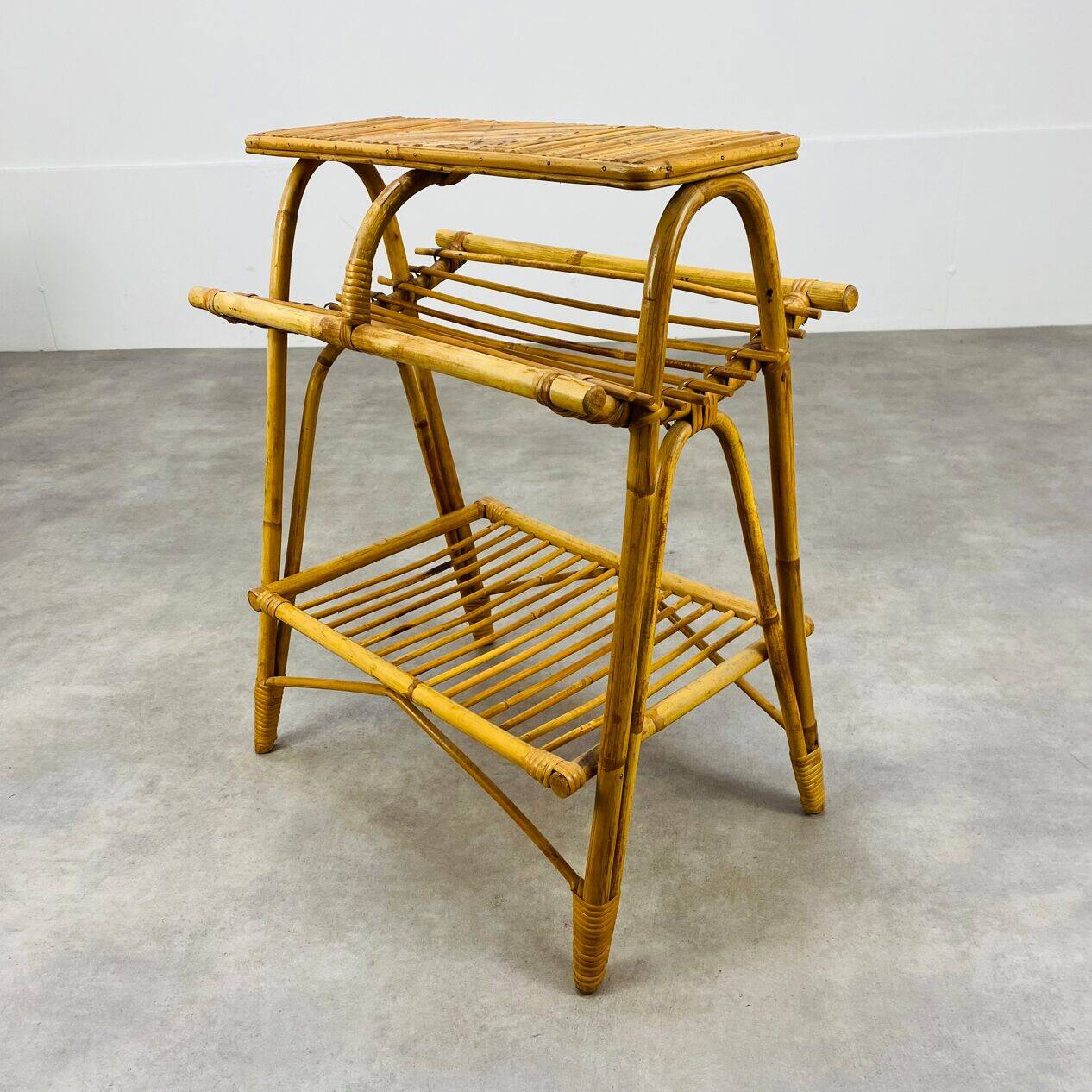 1960s rattan and bamboo coffee table, with its magazine rack.