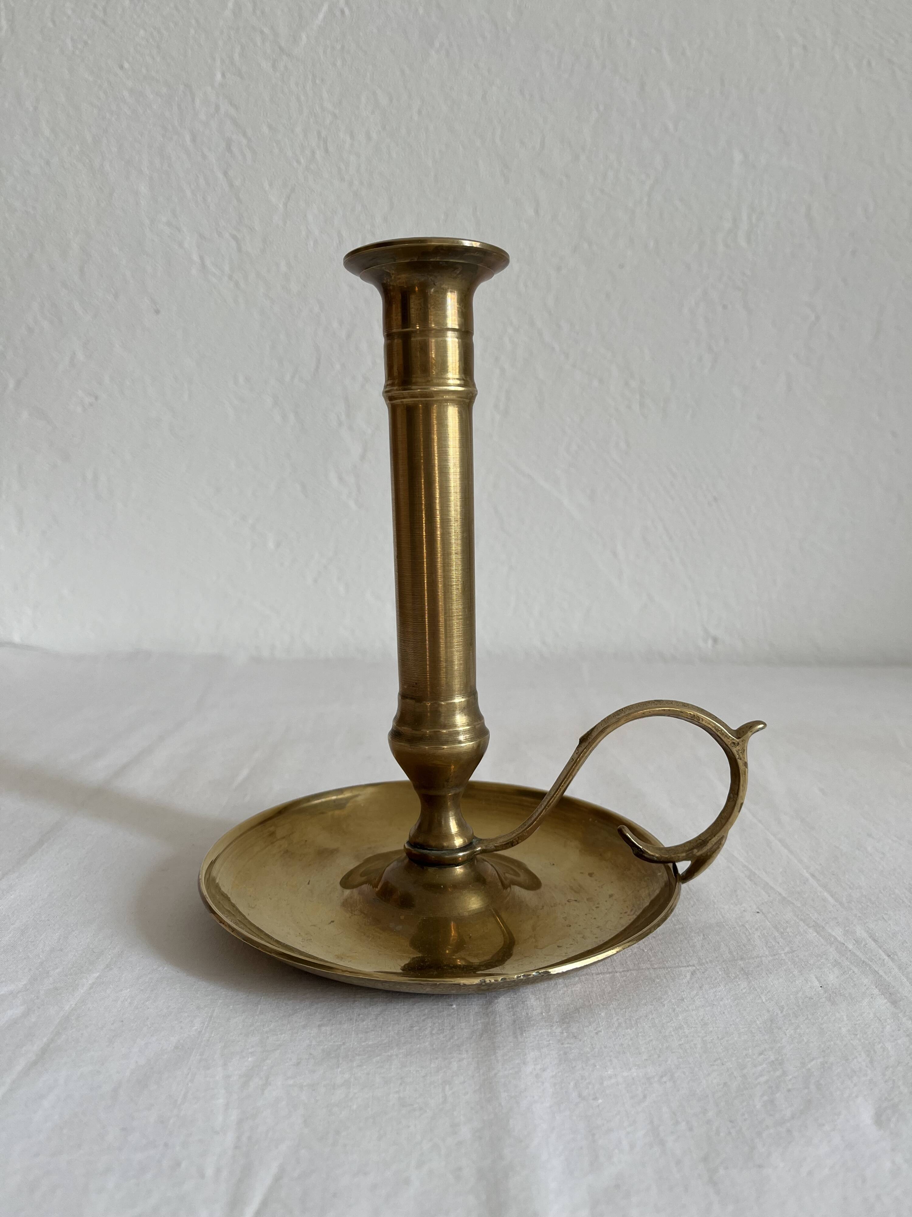 Vintage brass high hand candle holder