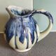 Blue and green glazed ceramic ribbed pitcher