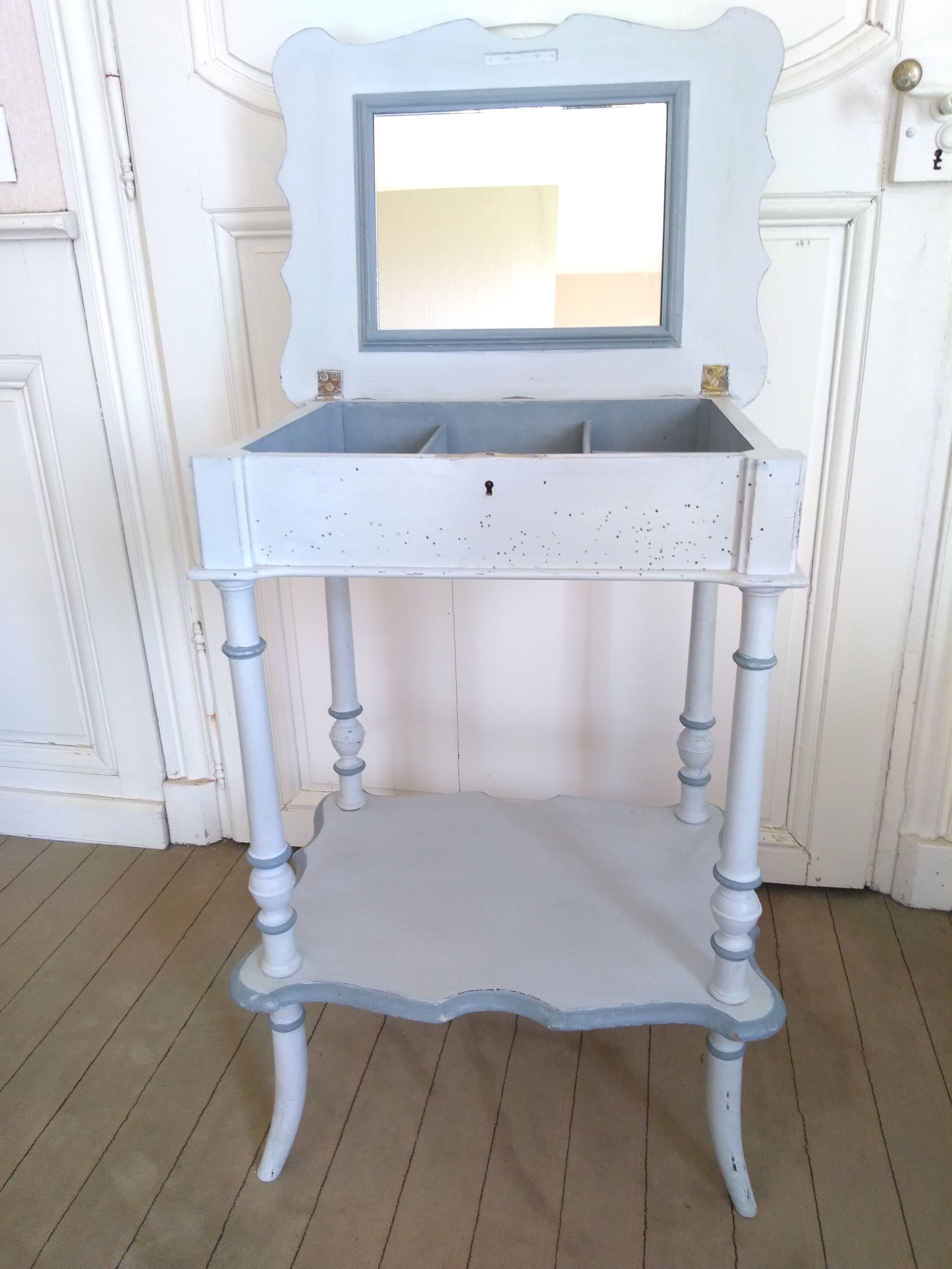 Side table with mirror interior and storage lockers