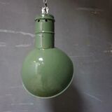 Old industrial enamel lamp in green
