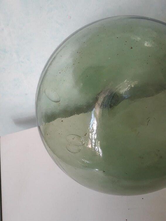 Old blown glass demijohn