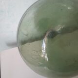 Old blown glass demijohn