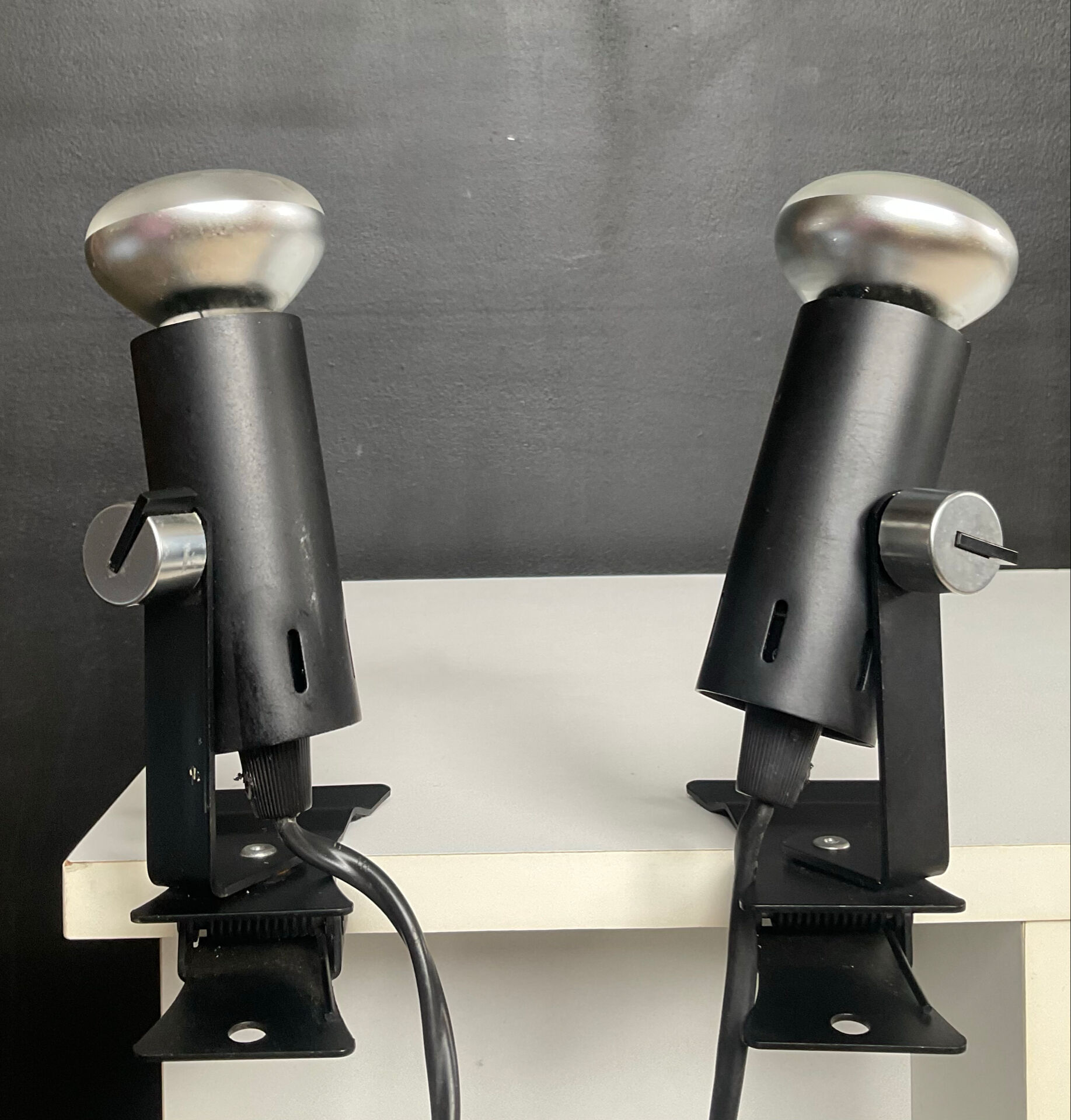 A pair of clamp lamps from the 1970s.