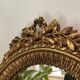 Round golden convex mirror with mouldings - witch's mirror