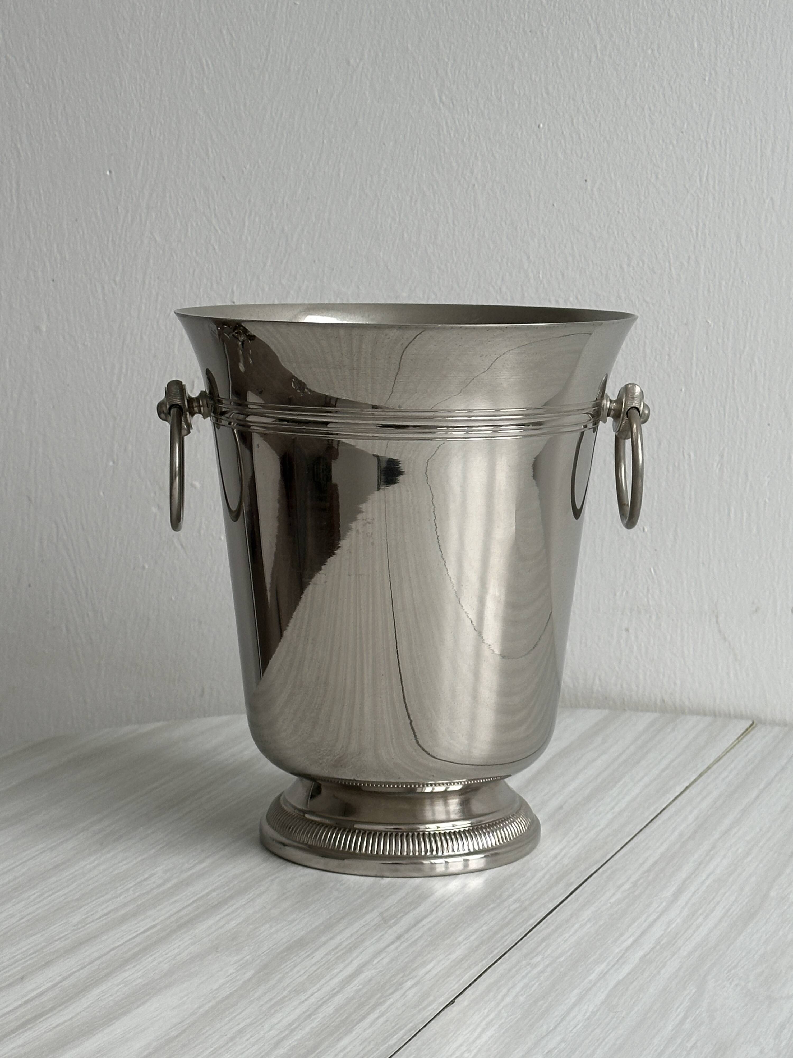 Shiny metal champagne bucket