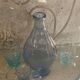Liquor service consisting of a blue glass decanter and. 3 small antique glasses