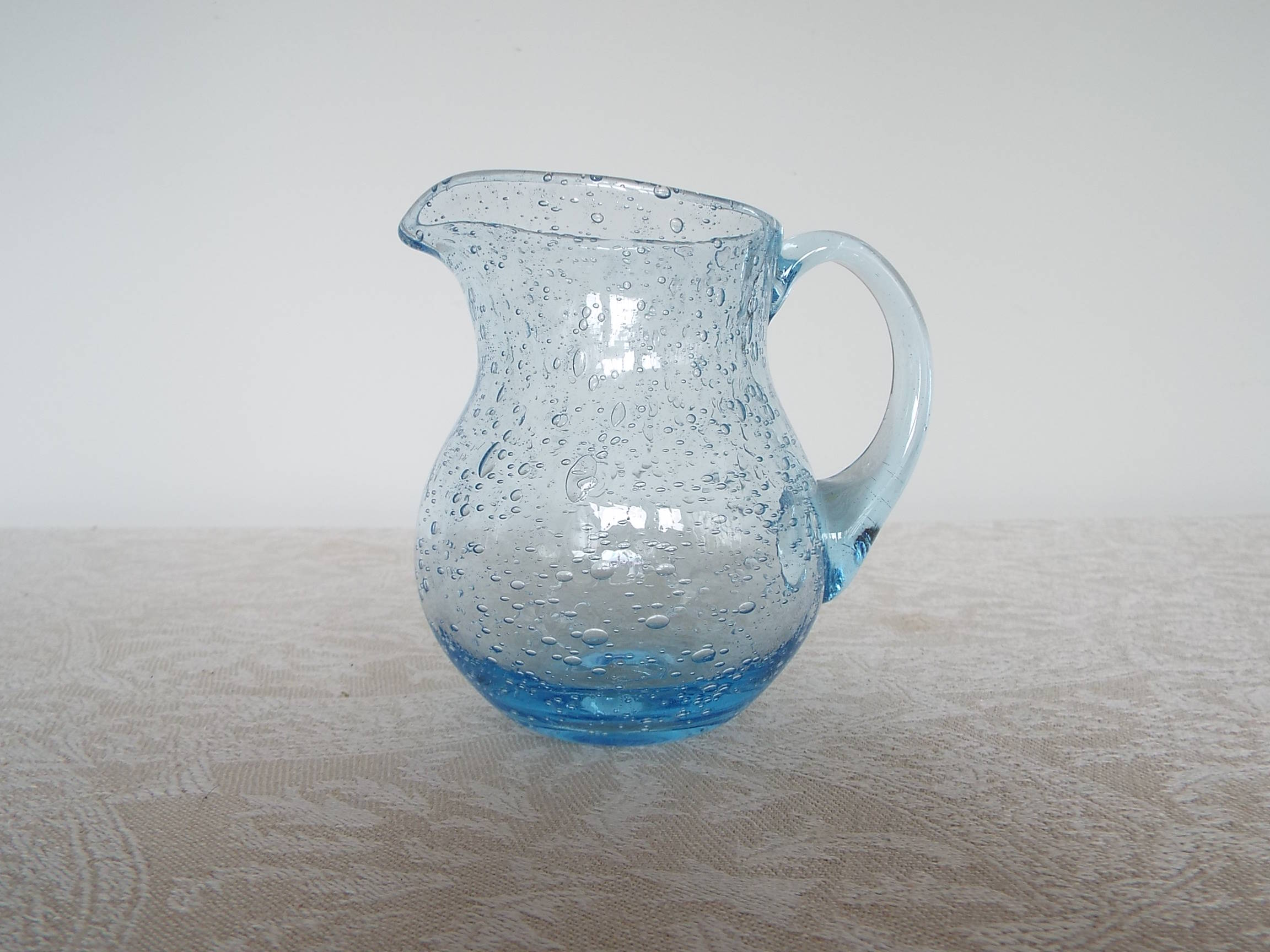 Bulled glass pitcher