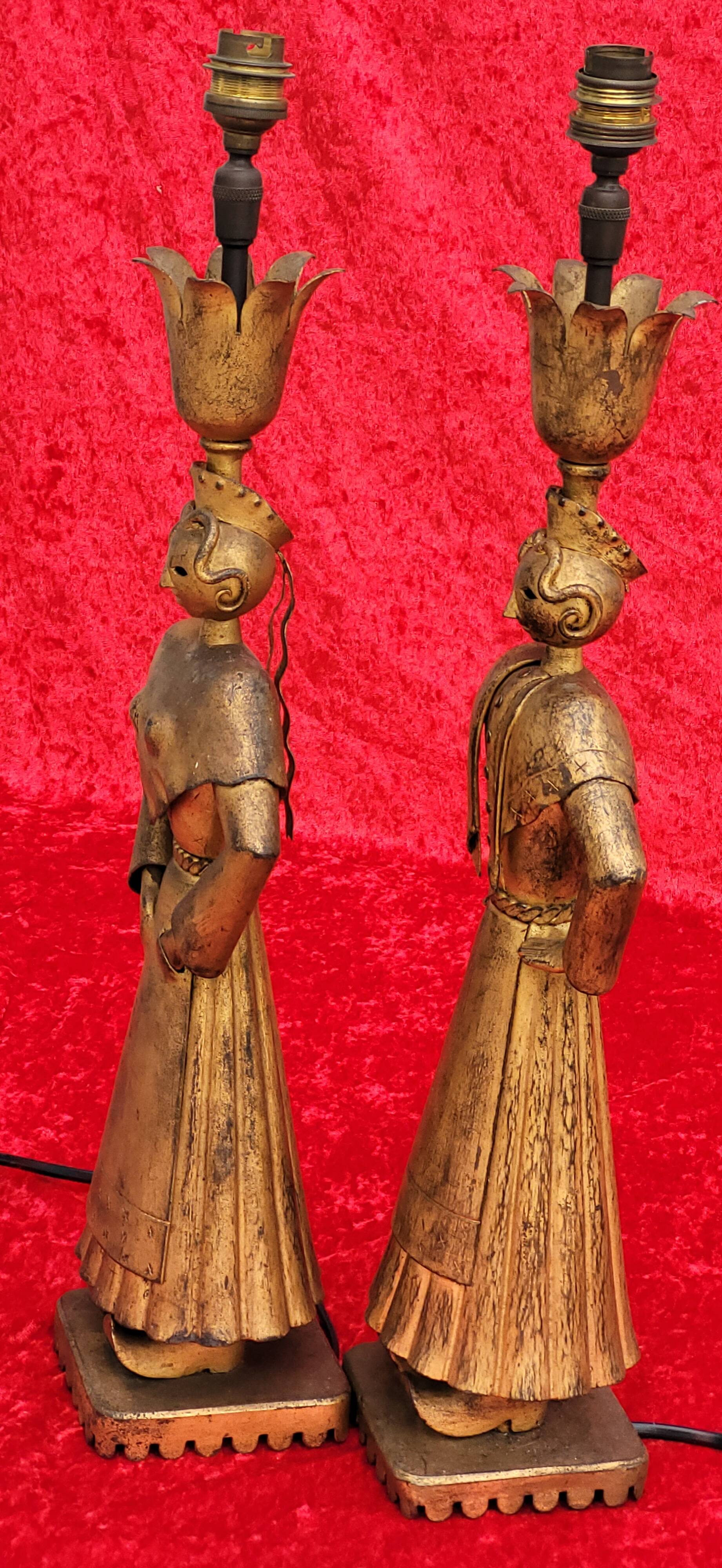 Pair of gilded beaten iron sculpture lamps attributed to Gilbert Poillerat