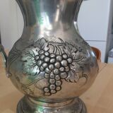 Pewter pitcher decorated with bunch of grapes