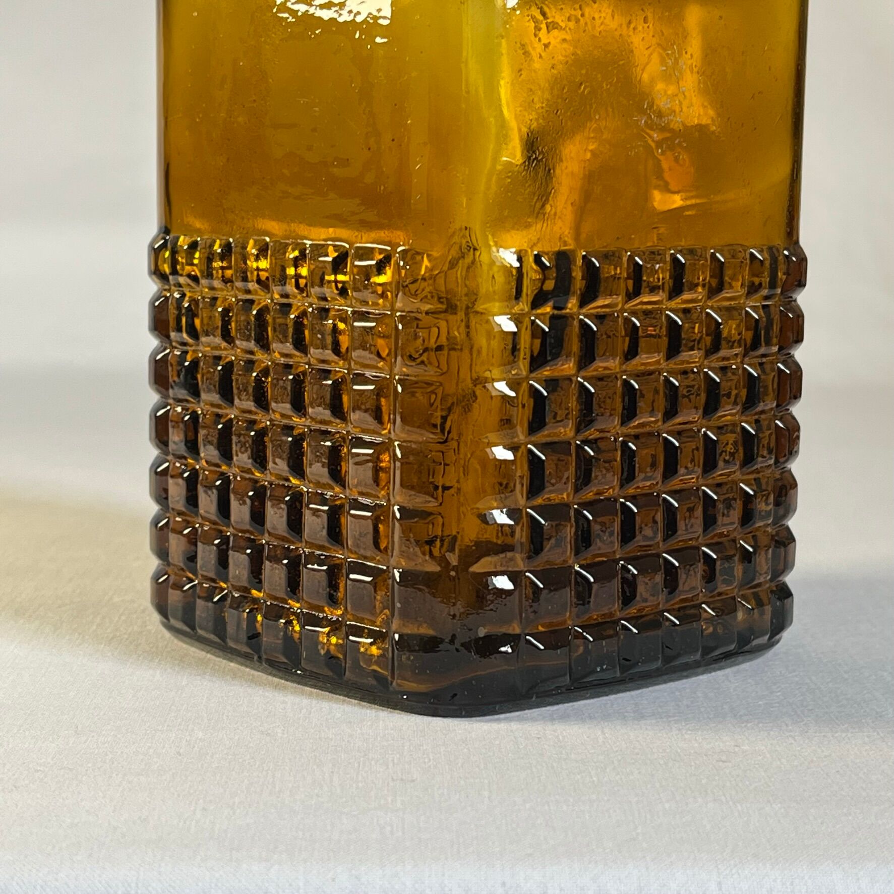 Amber glass and wood bottle