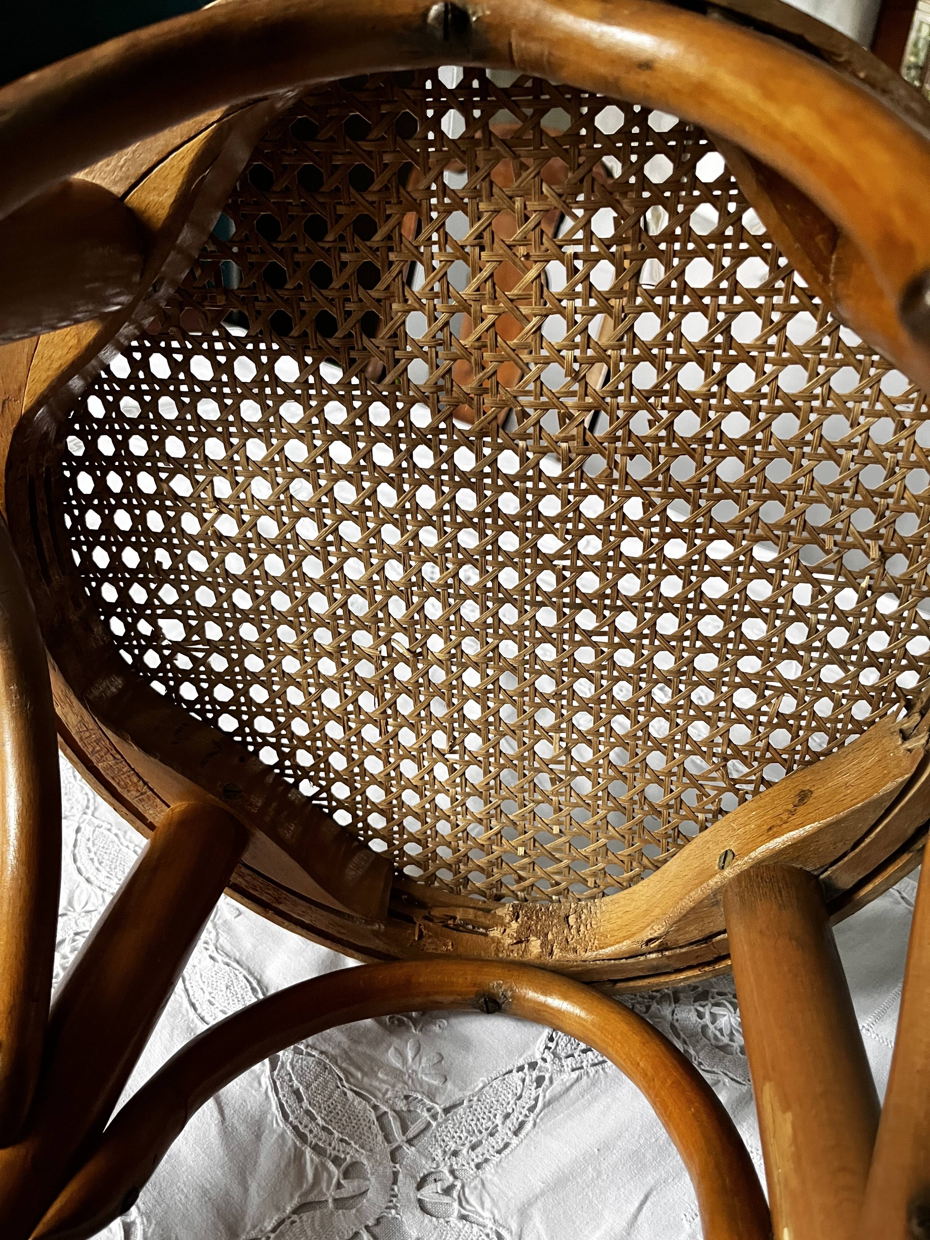 Curved wooden stool and cannage